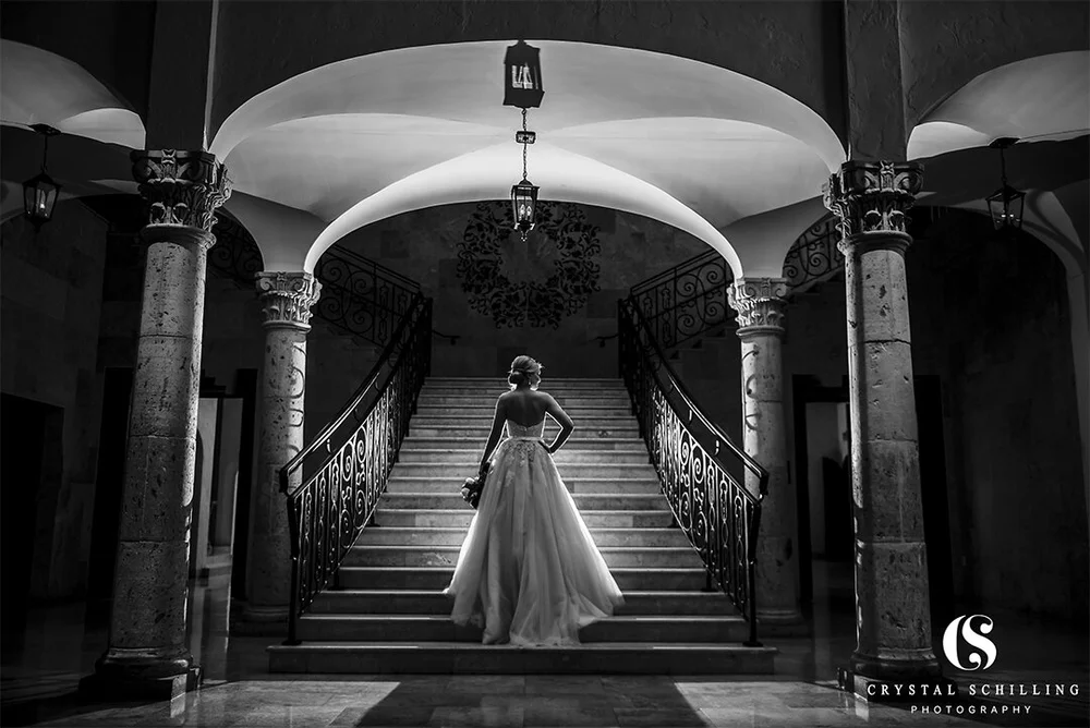 Black and white bridal portrait on the Carillon staircase at The Bell Tower on 34th, Houston, TX.